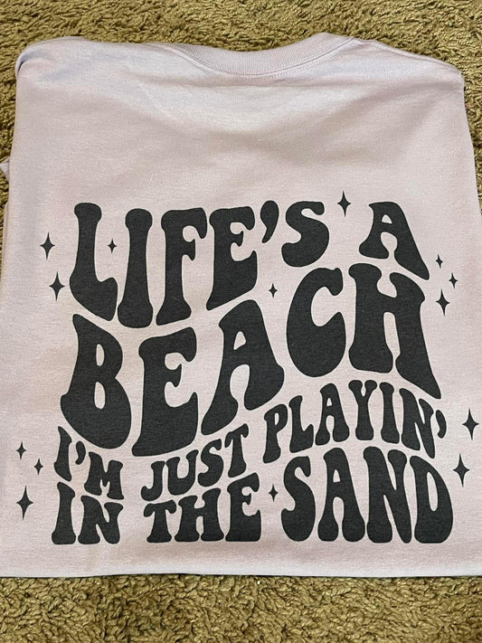 Life's a beach I'm just playin' in the sand